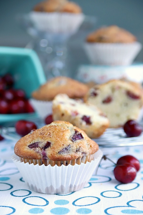 Tender cake-like muffins are light textured filled with fruit and nuts. Easy recipe for cherry almond muffins perfect for breakfast, snacking and teatime. 