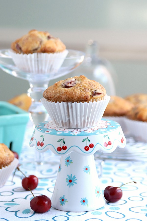 Bake a batch of cherry almond muffins for breakfast, snacking or teatime. Their cake-like texture filled with chunks of cherry and toasted almonds make them a hit! Easy recipe that goes together fast.