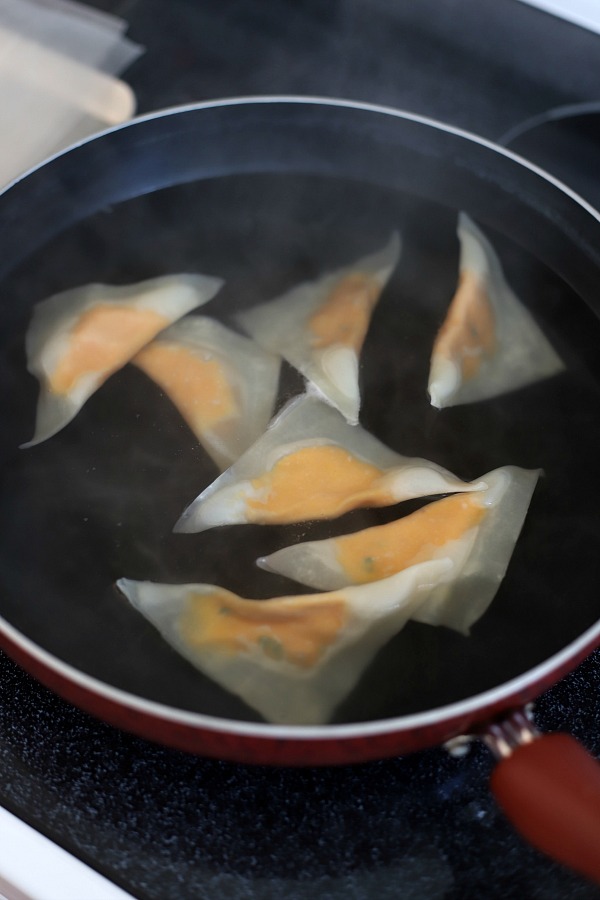 Sweet potato ravioli are pouches of filling in wonton wrappers, served with sage infused cream. An elegant vegetarian dinner entrée sure to please!
