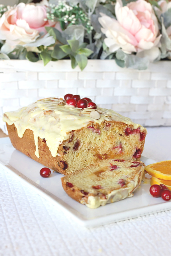 A delicious  idea for your Thanksgiving dinner, frosted apricot cranberry bread is moist and so good. With the orange frosting, it is almost like dessert. And, because it is a quick bread it is an easy recipe.