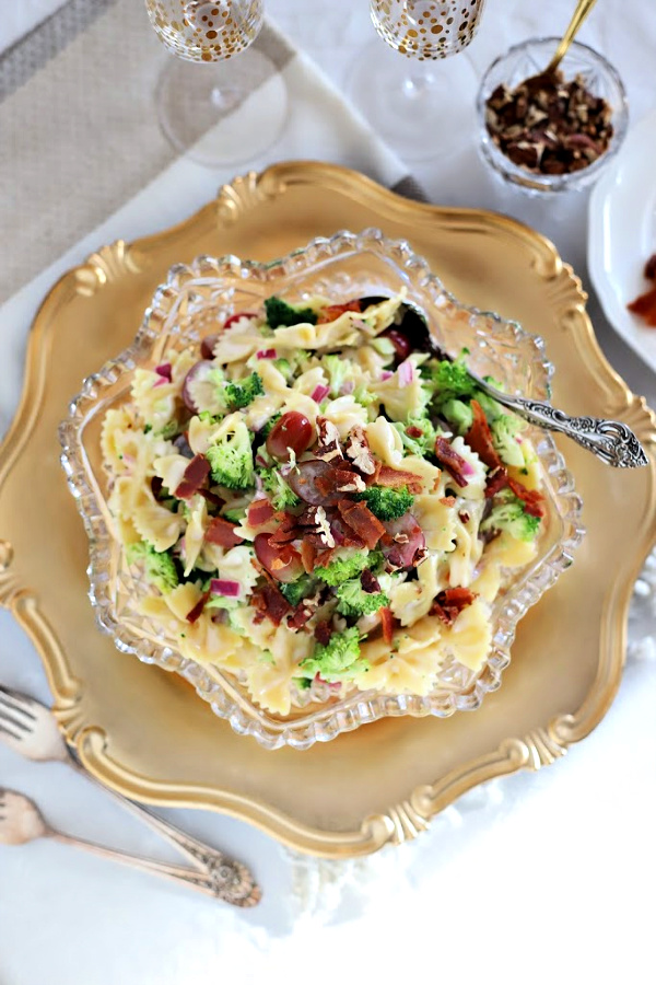 Tasty and colorful, Broccoli grape pasta salad is a perfect side dish, lunch entrée or light dinner meal. Tender pasta tossed with a creamy, sweet and tangy dressing and topped with toasted pecans and crisp bacon.