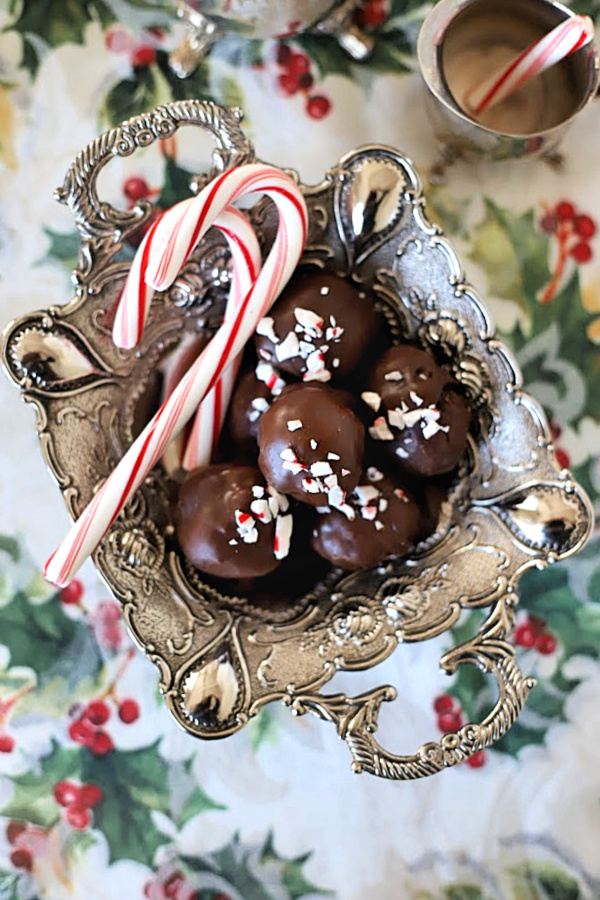 Easy yet elegant recipe for Oreo cookie balls begins with just three ingredients! Mix, shape and dip in melted chocolate. A yummy no-bake Christmas treat.