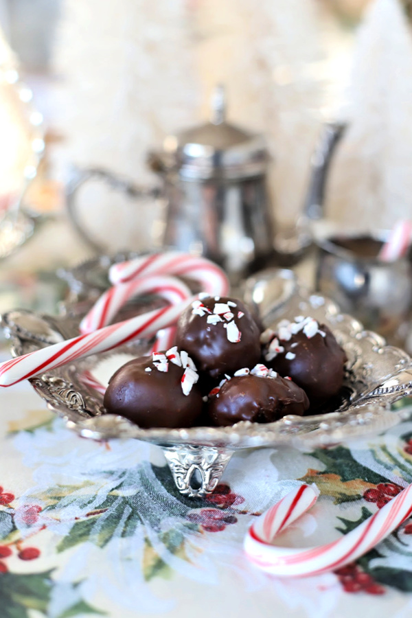 Easy yet elegant recipe for Oreo cookie balls begins with just three ingredients! Mix, shape and dip in melted chocolate. A yummy no-bake Christmas treat that looks so pretty in a candy dish or on the cookie tray. 