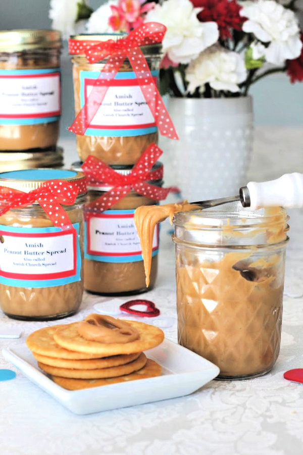 Dress up a jar of homemade Amish peanut butter church spread with a ribbon and tag for a perfect Valentine's Day gift for a friend or coworker. Sweet and creamy spread so good on crackers, bread, muffins and so much more!