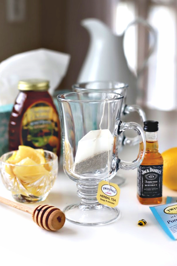 Make a very easy recipe for Hot Toddy when a cold or the flu has you down. It is warm and tasty with whiskey, tea, honey and lemon to help relieve symptoms so you can rest and feel better.