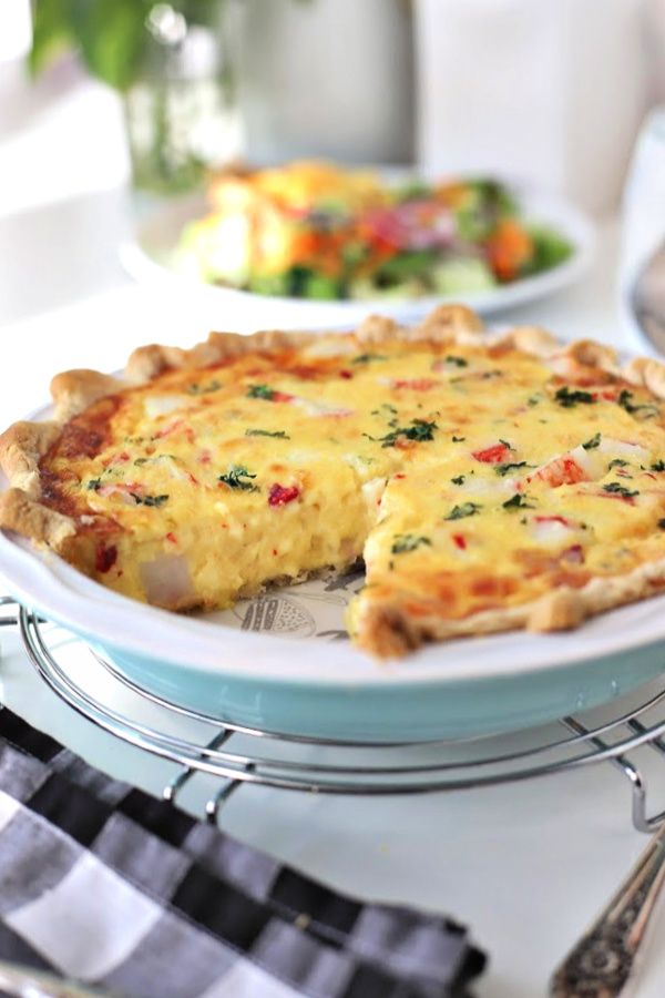An easy French tart, crab quiche consists of a bottom crust and filled with a savory egg and cream custard with crab or imitation seafood. It is baked and can be served either hot, room temperature or cold. Perfect for brunch or dinner. 