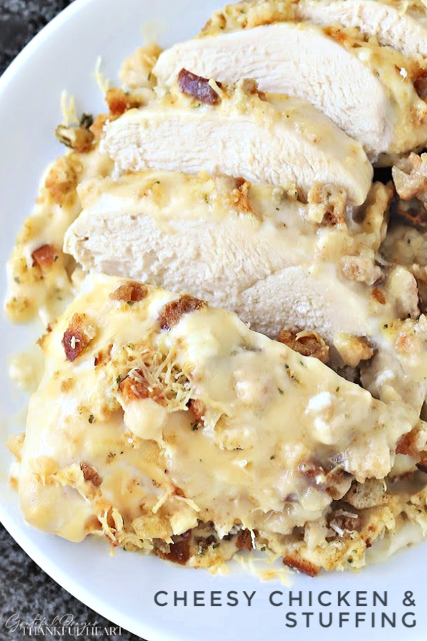 Cheesy Chicken & Stuffing is an easy recipe of baked chicken in a creamy sauce topped with stuffing and melted Swiss cheese. Perfect potluck casserole or kid-friendly weeknight dinner meal. And best of all... it is a cinch to make!