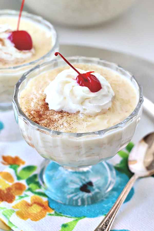 Easy recipe for creamy rice pudding. This old-fashioned dessert is not overly sweet. Simmered gently on the stove top until the rice is tender but not mushy, it turns out perfect time after time.