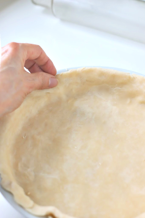 Making you own homemade pie crust is a lot easier than you think and much less expensive.  Easy step-by-step photos for a perfect crust using shortening for your apple, pumpkin and savory pies.