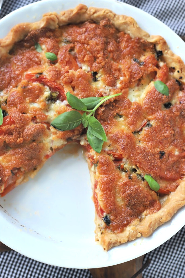 Enjoy the bright flavor combo of fresh tomatoes and basil. Combined with creamy cheese in a flaky pastry crust, basil tomato pie is savory and delicious!