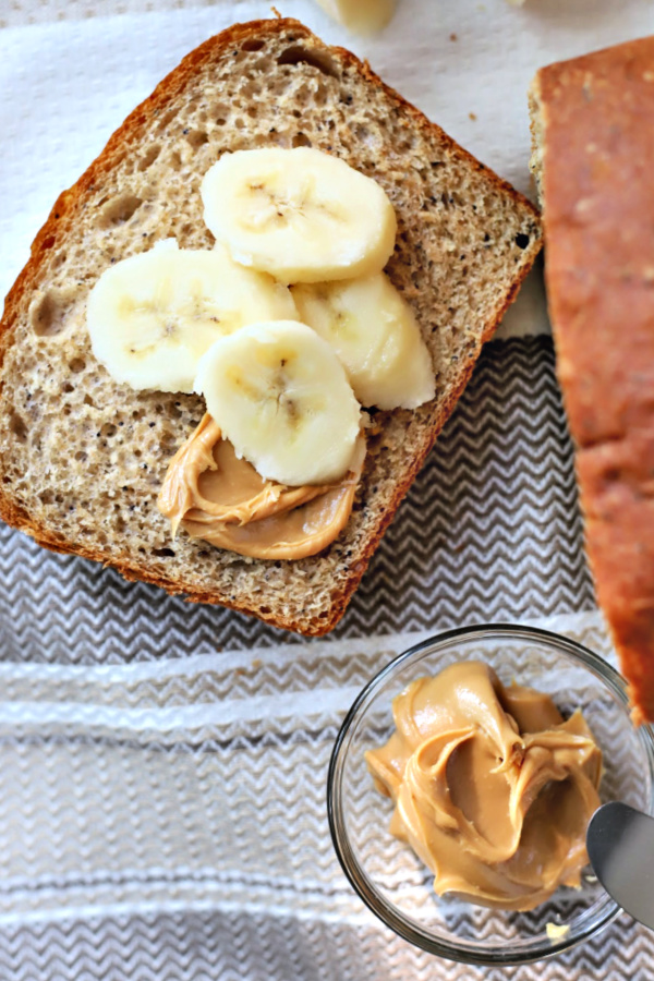 Easy recipe for healthy whole wheat bread with banana and honey. Dough made using a bread machine then shaped and baked for a delicious, lightly sweet yeast bread. Slices well for sandwiches and perfect spread with peanut butter!