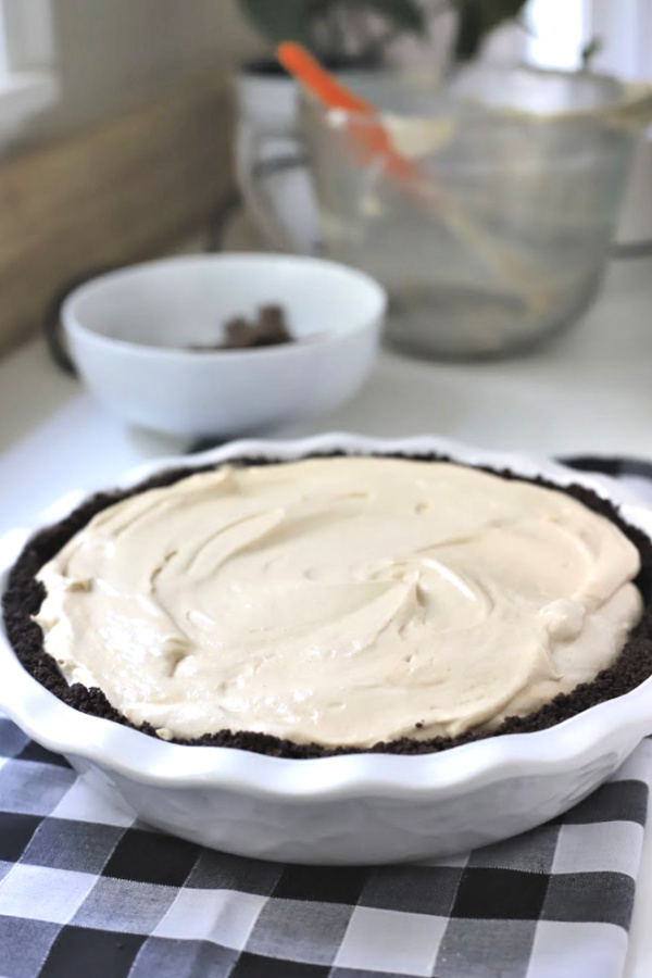 Easy recipe for no-bake peanut butter pie with cream cheese and whipped topping in a heavenly chocolate crust. Creamy, frosty and easily made from scratch!