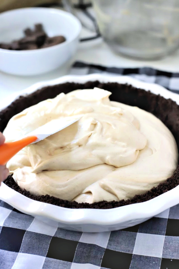 Easy recipe for no-bake peanut butter pie with cream cheese and whipped topping in a heavenly chocolate crust. Creamy, frosty and easily made from scratch!