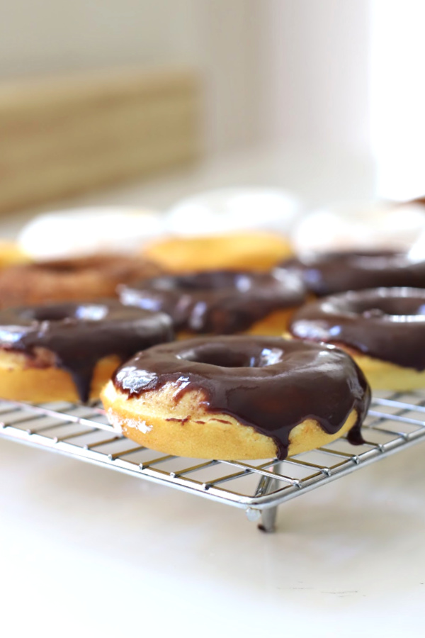 Make a batch of homemade baked cake donuts. Easy recipe and fun to make with kids or grandchildren. Add chocolate frosting, powered sugar, cinnamon sugar or just leave plain.