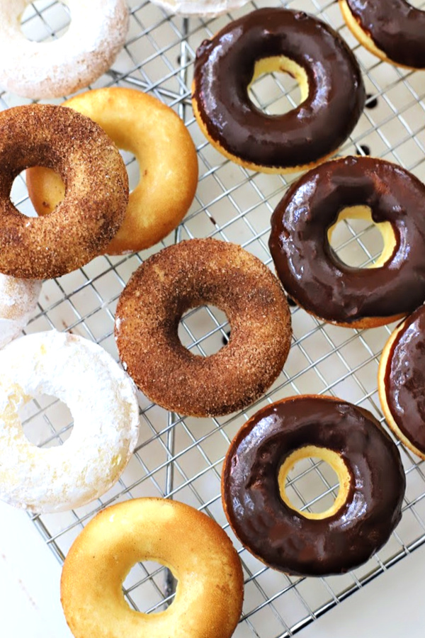 You can use a butter knife to spread the frosting onto the donuts or just drop a donut into the bowl to coat the top. Give a little twist and lift out to a rack to harden. 