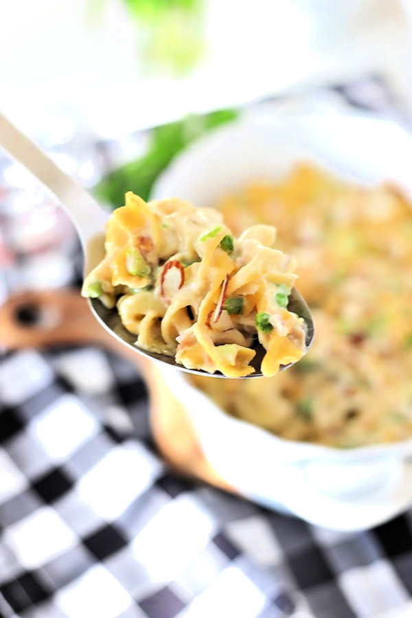 Easy recipe for classic tuna noodle casserole. Made with tender egg noodles, cream of chicken soup, mayo and cheddar cheese, it is delicious and budget-friendly meal. With or without peas, as you like.