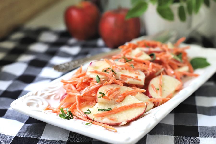 Crunchy, creamy and healthy, apple carrot slaw is a quick and easy recipe for a salad-like side dish. Perfect with burgers, grilled chicken or other entrees. Rice or cider vinegar along with basil give great flavor.