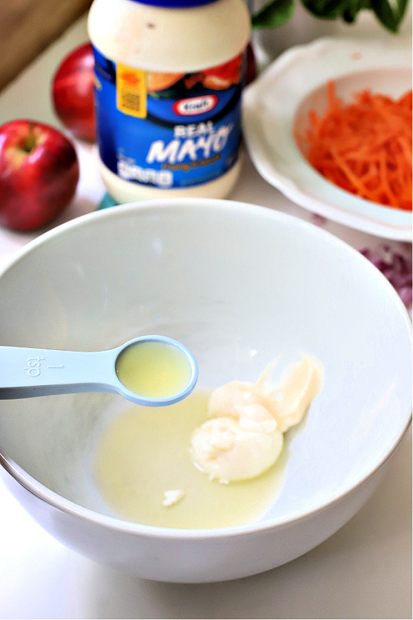Easy recipe for making an apple carrot slaw that is crunchy, creamy and healthy.