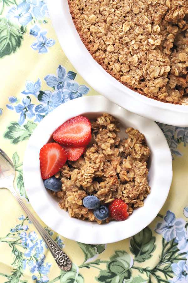 Easy recipe for a lightened version of baked oatmeal. Applesauce is substituted for some of the butter but it is still delicious and a great breakfast with milk, fruit or yogurt.