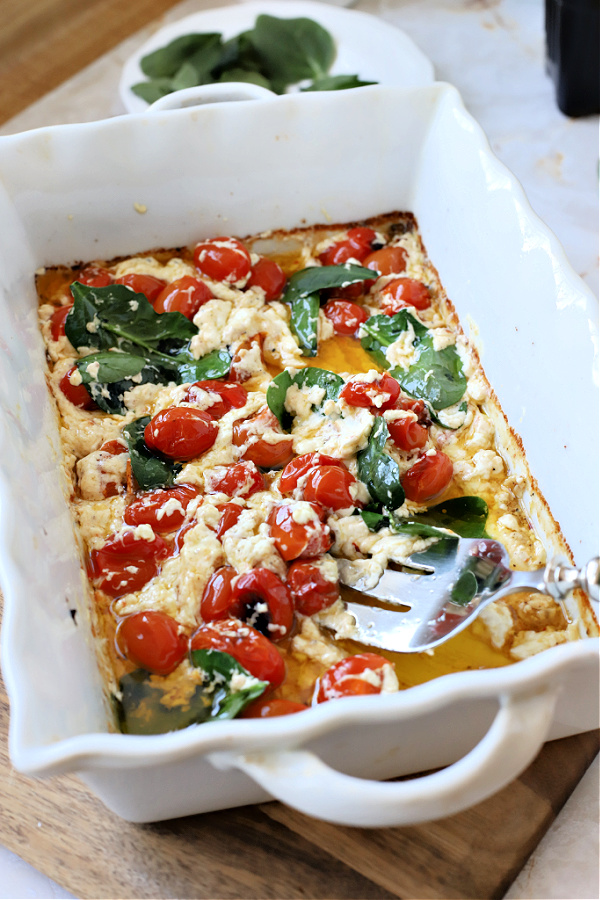 My variation of a recipe for baked tomato and feta for pasta that was seen on TicTok, is easy and tasty! Cherry tomatoes are roasted with creamy feta and garlic for spaghetti, penne, ziti or your favorite pasta.
