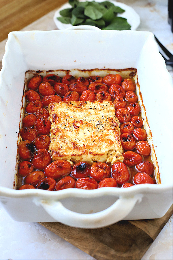 Easy & tasty recipe for baked tomato & feta perfect for pasta. Seen on TicTok, cherry tomatoes are roasted with olive oil and seasoning. 