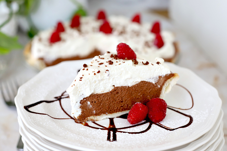 Easy recipe for a creamy, decadent chocolate cream pie with cream cheese and dark chocolate chips using a homemade or refrigerator pie crust. 