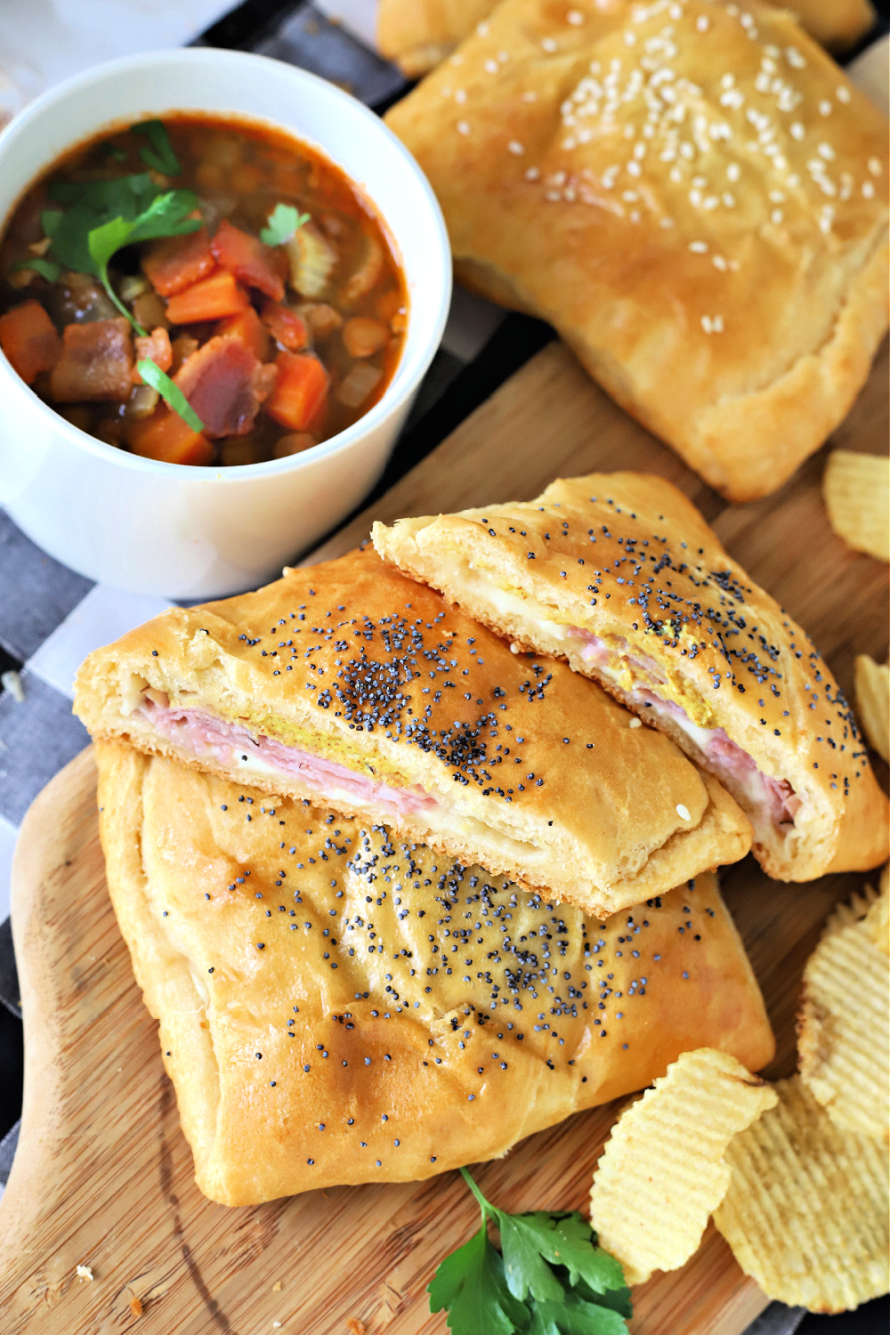 Ham & cheese hand pies, a quick and easy hot sandwich. Fill crescent roll dough with Swiss, cheddar or American cheese and bake!