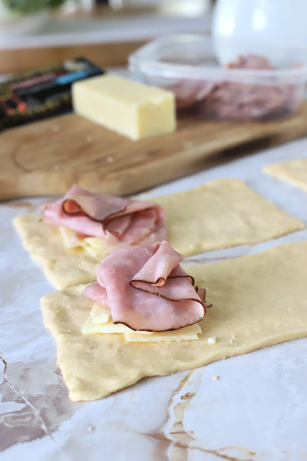 adding ham and cheese to crescent hand pies