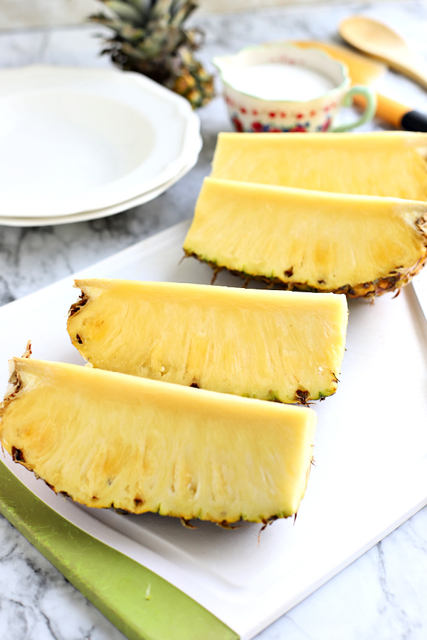 slicing a fresh pineapple