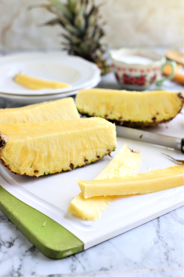 cutting a fresh pineapple