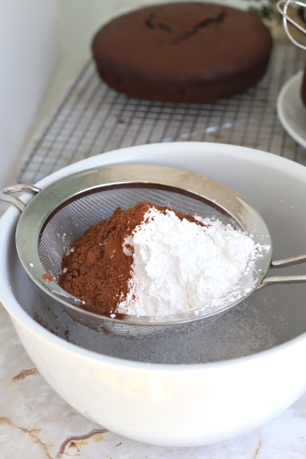 Sifting the cocoa powder and the confectioners sugar for fluffy chocolate frosting.