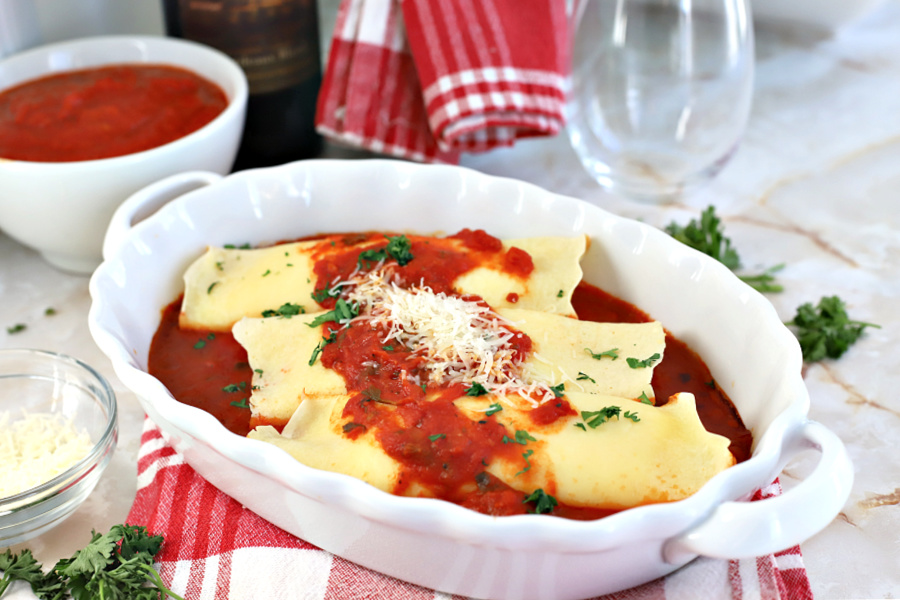 Easy recipe for homemade Ricotta and Asiago cheese filled manicotti crepes.