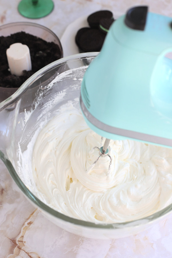 Cream cheese mixture for minty chocolate cheesecake parfait St Patrick's Day dessert.