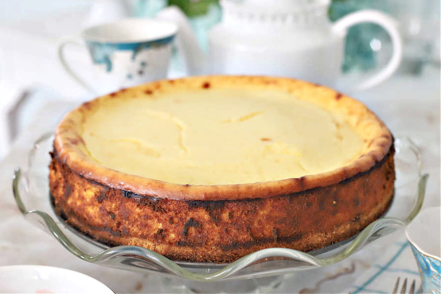 Rich and ultra creamy, Philadelphia NY style cheesecake. Recipe uses lots of cream cheese cream, eggs with a hint of almond and lemon citrus.