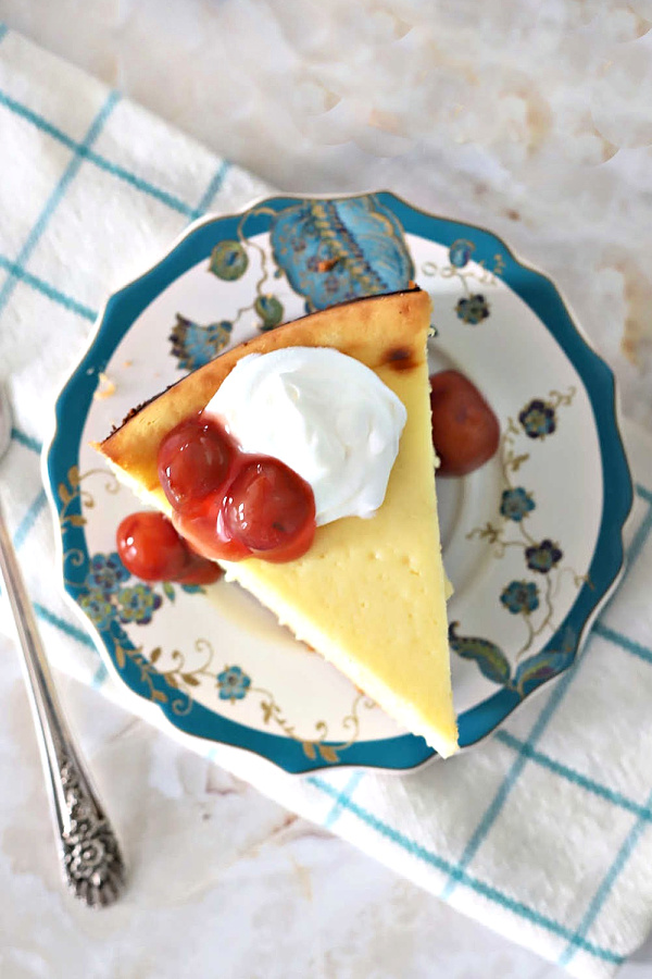 Rich and ultra creamy, Philadelphia NY style cheesecake. Recipe uses lots of cream cheese cream, eggs with a hint of almond and lemon citrus.