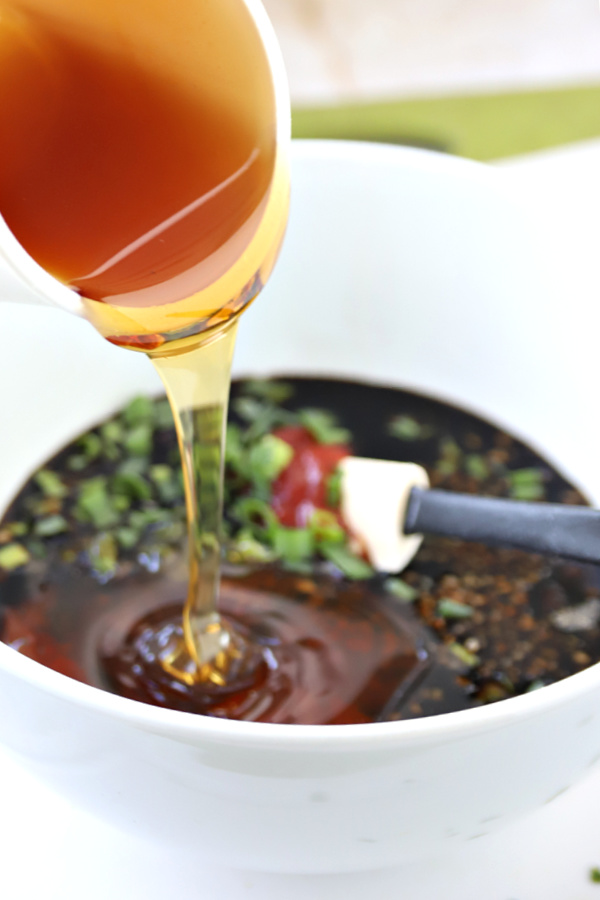 Soy sauce, honey, garlic, fresh ginger sauce for honey chicken wings appetizer recipe.