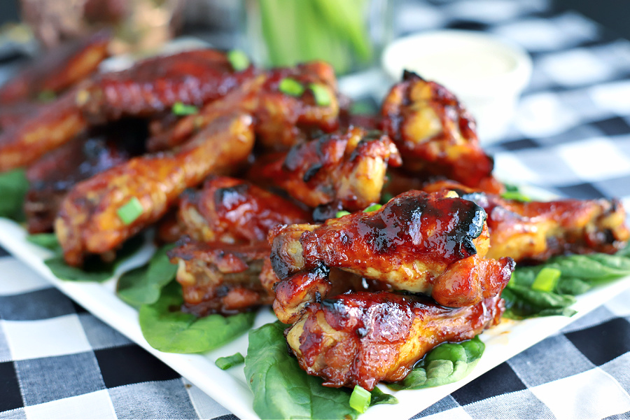 Easy appetizer recipe for honey glazed chicken wings with a sweet and sticky garlic and soy sauce that are baked rather than fried.
