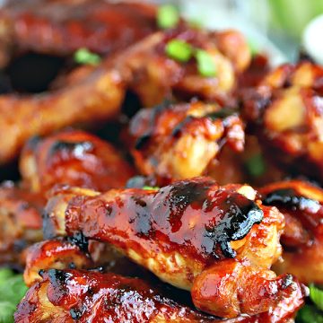Easy appetizer recipe for honey glazed chicken wings with a sweet and sticky garlic and soy sauce that are baked rather than fried.