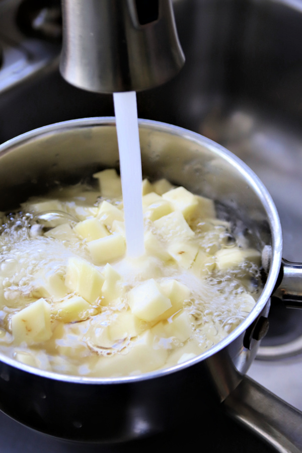 Boiling potatoes for bangers and mash.
