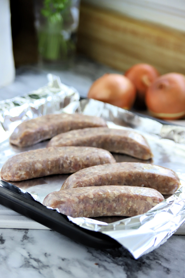 Oven baking sausage for bangers and mash with onion gravy.