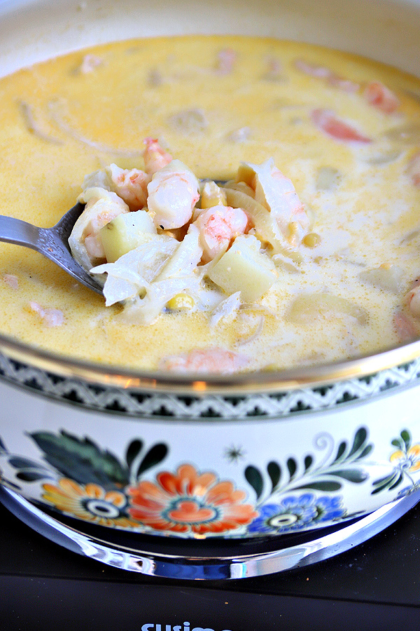 Pot of delicious homemade shrimp and corn chowder soup.